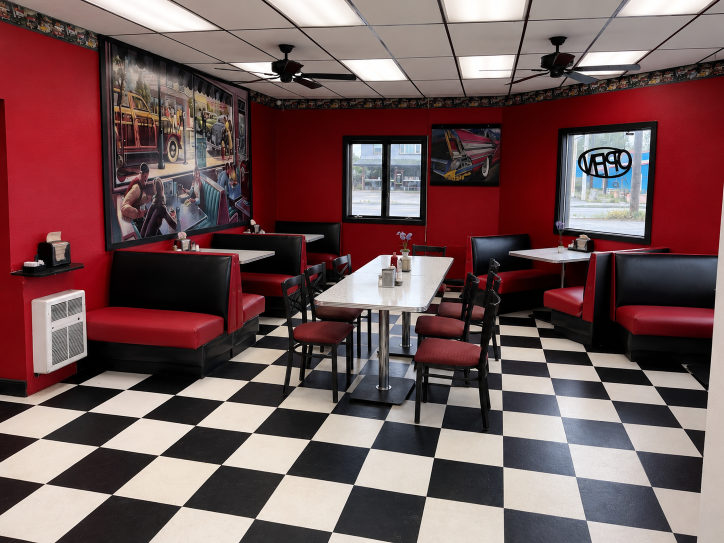 Inside C&J's Drive In in Fairbanks — red booths, diner counter, and vintage signage