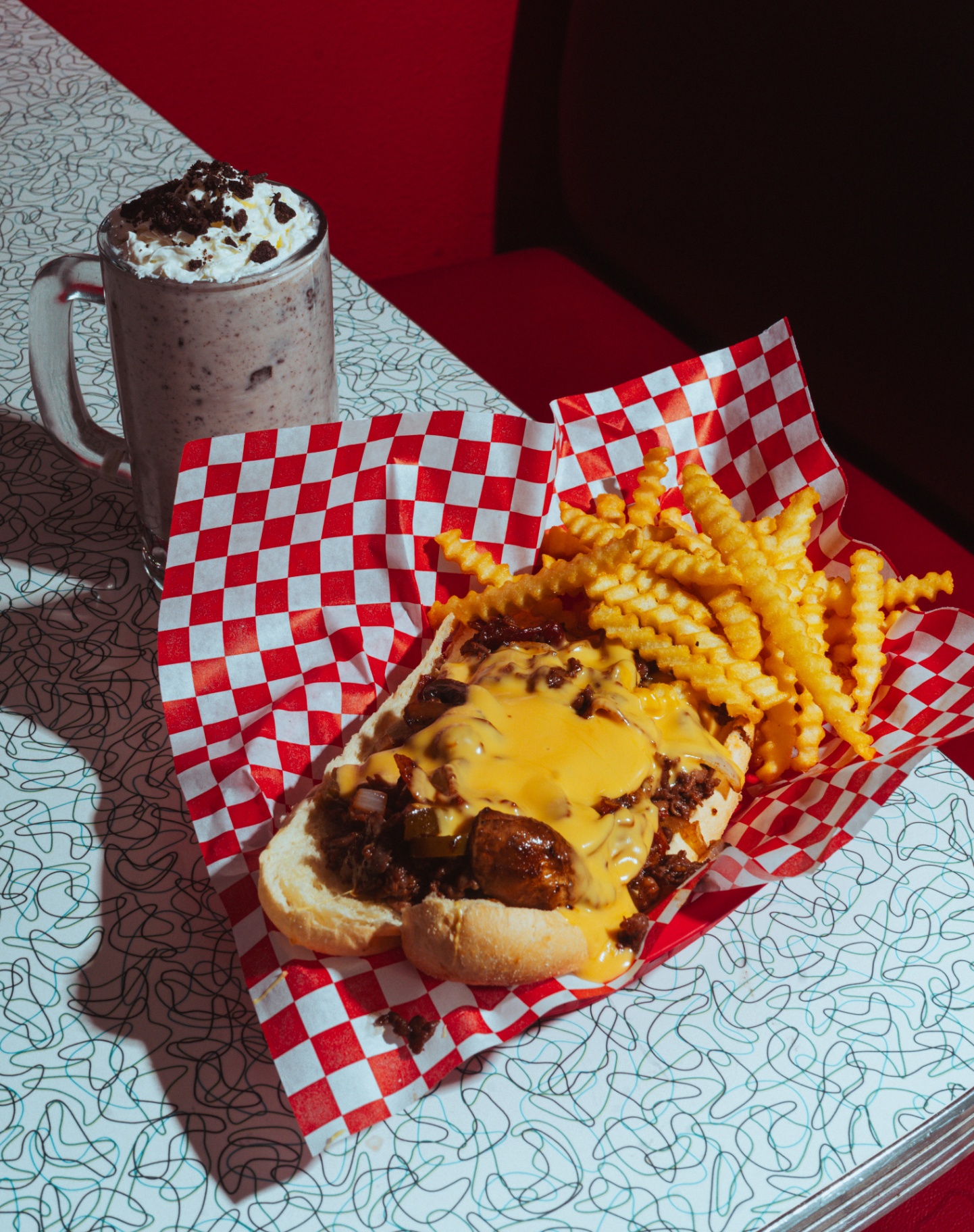 Chili cheese dog with crinkle fries and an Oreo shake